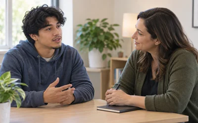 Young adult discussing personal goals with a counselor.